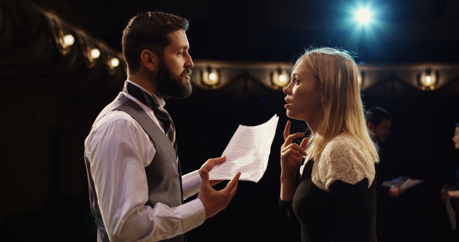 Actors rehearsing in a theater