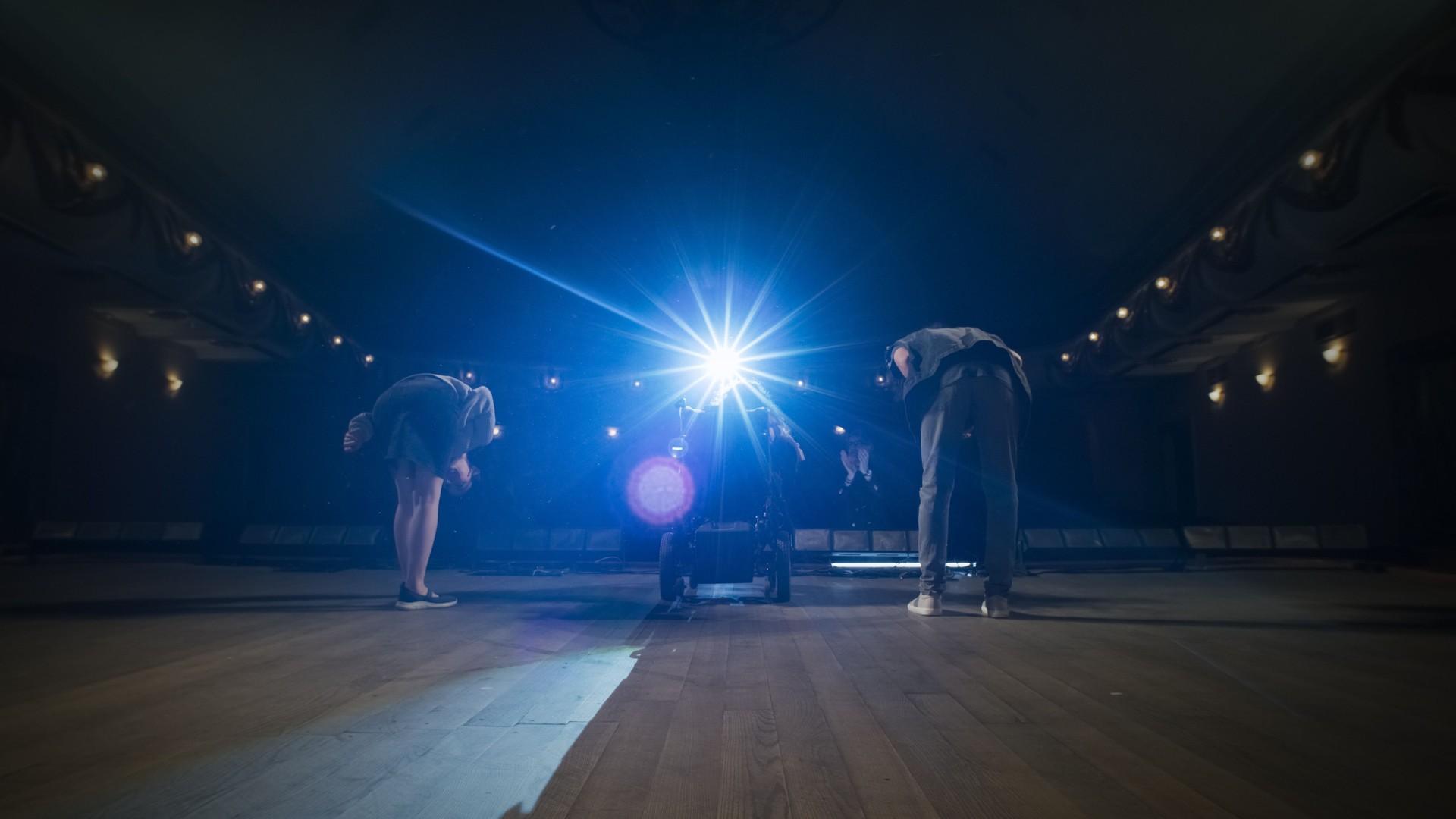 The cast with disabled actress bowing on stage